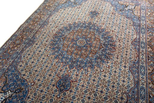 Backside of handmade 2000s Moud rug showing knot structure and weave density