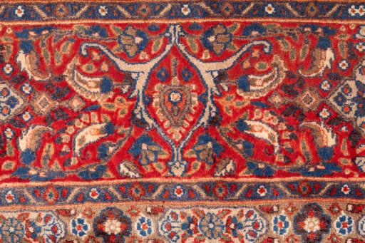 Corner detail of 1970s Moud rug showing border pattern and Wool pile