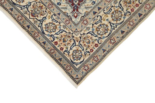 Backside of handmade New Nain rug showing knot structure and weave density