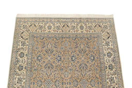 Surface texture of 1960s Nain rug with natural Wool and intricate pattern
