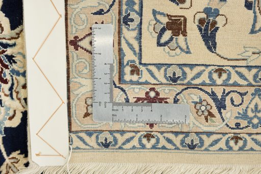 Close-up detail of 1980s Nain rug from Iran / Persia showing Wool weave