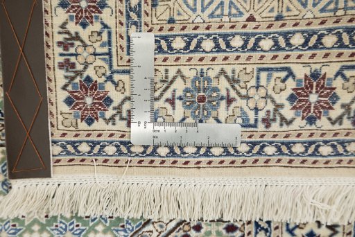 Corner detail of New Nain rug showing border pattern and Wool pile