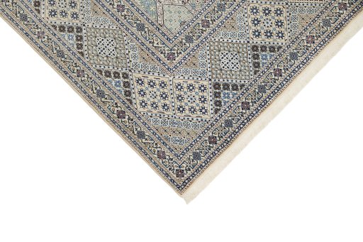 Backside of handmade New Nain rug showing knot structure and weave density