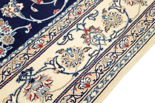 Corner detail of 1990s Nain rug showing border pattern and Wool pile