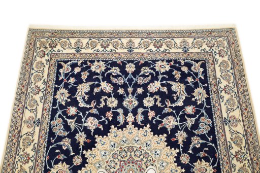 Surface texture of 1990s Nain rug with natural Wool and intricate pattern