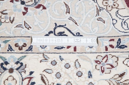 Backside of handmade New Nain rug showing knot structure and weave density