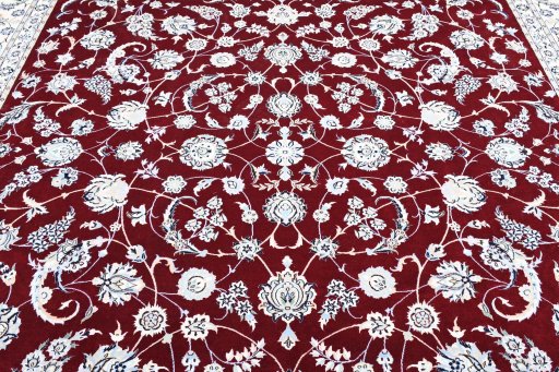 Backside of handmade New Nain rug showing knot structure and weave density