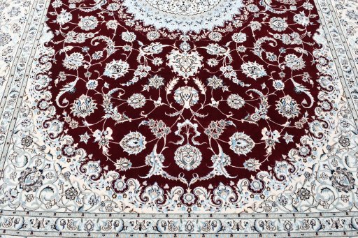 Backside of handmade New Nain rug showing knot structure and weave density
