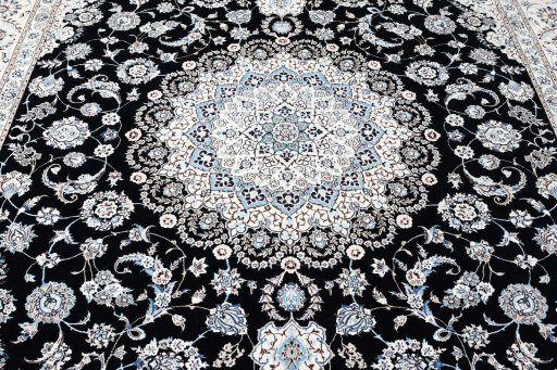 Backside of handmade New Nain rug showing knot structure and weave density