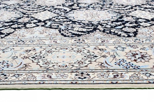 Backside of handmade New Nain rug showing knot structure and weave density
