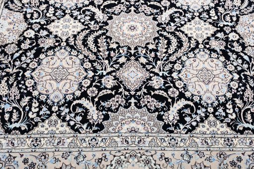 Backside of handmade New Nain rug showing knot structure and weave density