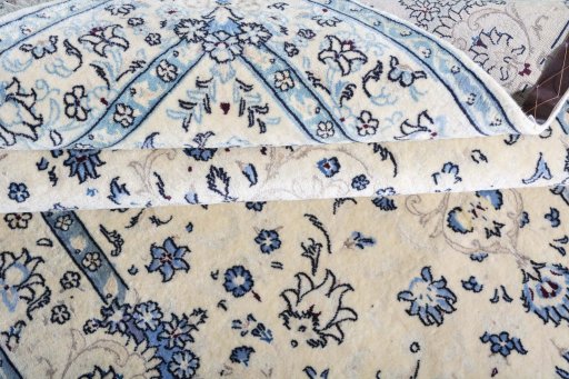 Corner detail of 2000s Nain rug showing border pattern and Wool pile