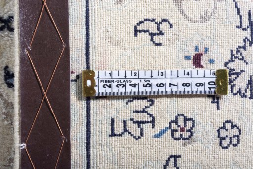 Surface texture of 2000s Nain rug with natural Wool and intricate pattern