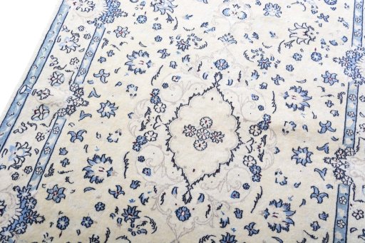 Backside of handmade 2000s Nain rug showing knot structure and weave density
