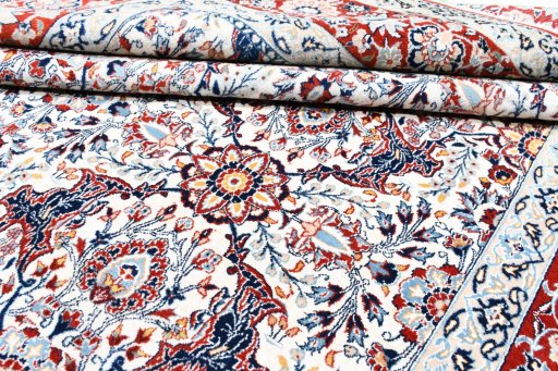 Corner detail of 1930s Nain rug showing border pattern and Wool pile