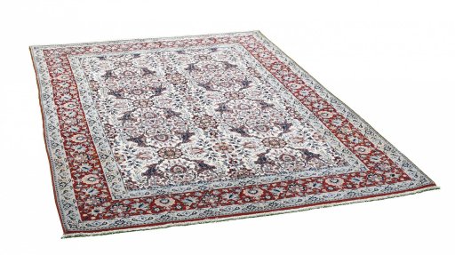 Corner detail of 1930s Nain rug showing border pattern and Wool pile