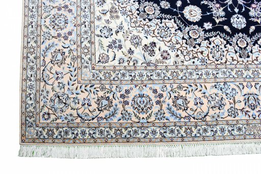 Backside of handmade New Nain rug showing knot structure and weave density