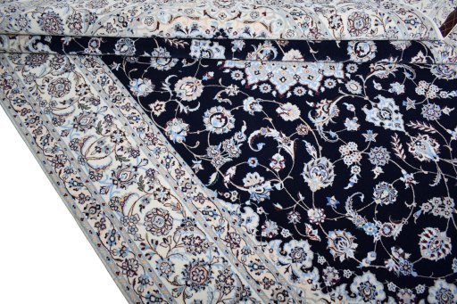 Backside of handmade New Nain rug showing knot structure and weave density