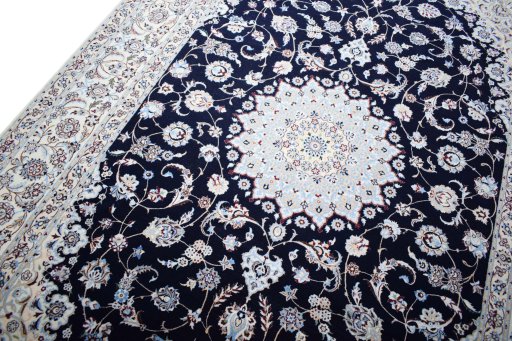 Backside of handmade New Nain rug showing knot structure and weave density