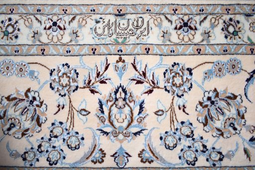 Corner detail of New Nain rug showing border pattern and Cork pile
