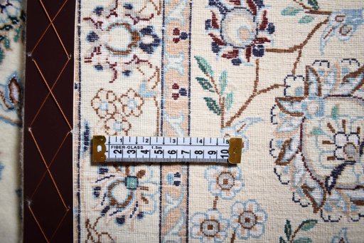 Backside of handmade New Nain rug showing knot structure and weave density