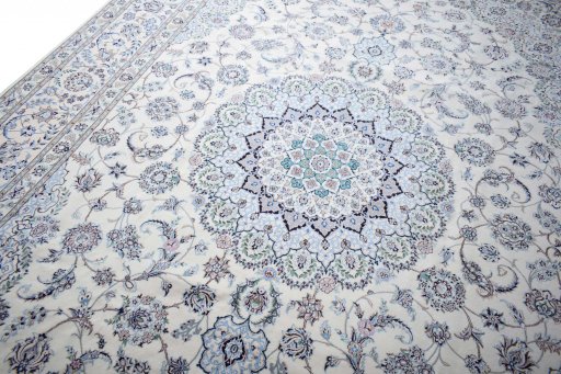 Backside of handmade New Nain rug showing knot structure and weave density