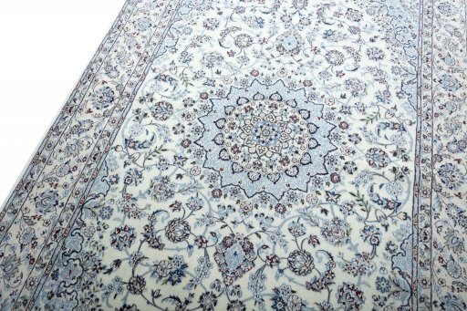 Backside of handmade New Nain rug showing knot structure and weave density