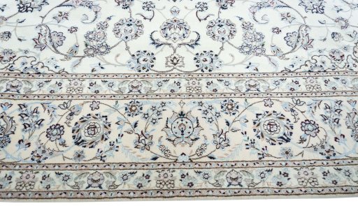 Corner detail of New Nain rug showing border pattern and Cork pile