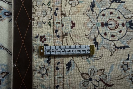 Backside of handmade New Nain rug showing knot structure and weave density