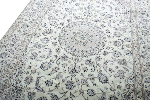 Backside of handmade New Nain rug showing knot structure and weave density