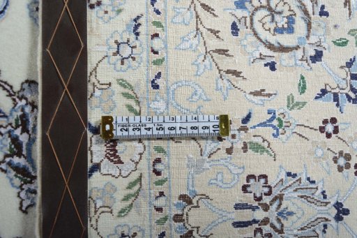 Backside of handmade New Nain rug showing knot structure and weave density
