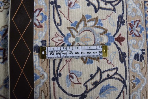 Backside of handmade New Nain rug showing knot structure and weave density