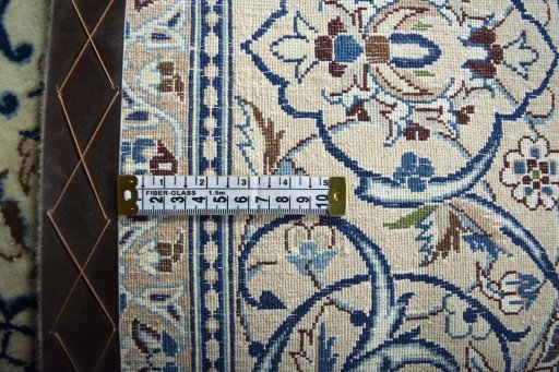 Backside of handmade New Nain rug showing knot structure and weave density