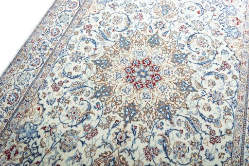 Backside of handmade New Nain rug showing knot structure and weave density