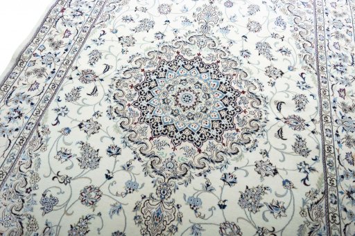 Backside of handmade New Nain rug showing knot structure and weave density