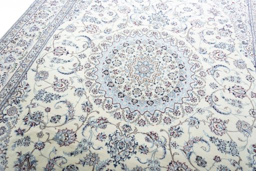 Backside of handmade New Nain rug showing knot structure and weave density