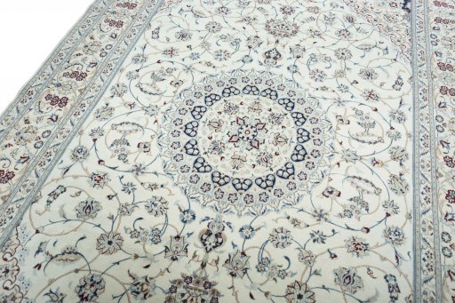 Backside of handmade New Nain rug showing knot structure and weave density