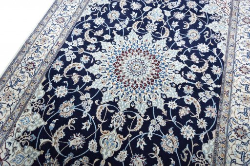 Backside of handmade New Nain rug showing knot structure and weave density