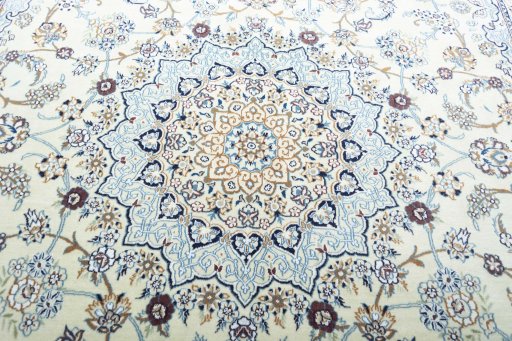 Backside of handmade New Nain rug showing knot structure and weave density