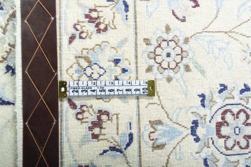 Backside of handmade New Nain rug showing knot structure and weave density