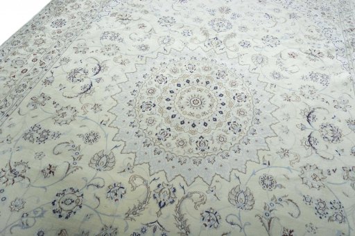 Backside of handmade New Nain rug showing knot structure and weave density