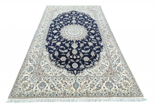 Backside of handmade New Nain rug showing knot structure and weave density