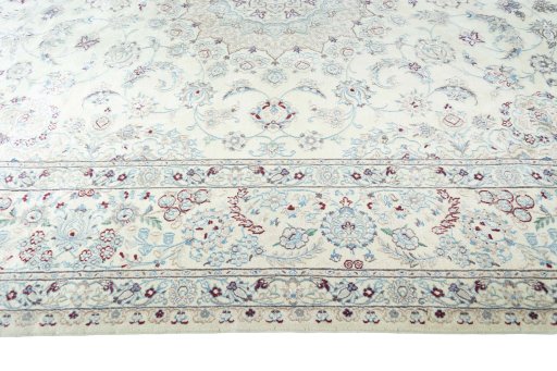 Corner detail of 2000s Nain rug showing border pattern and Wool pile