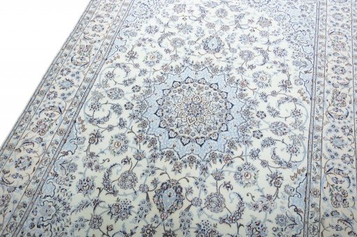 Backside of handmade New Nain rug showing knot structure and weave density
