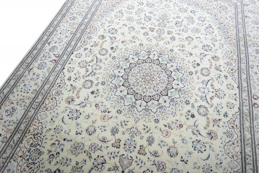 Backside of handmade New Nain rug showing knot structure and weave density