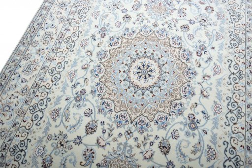 Backside of handmade New Nain rug showing knot structure and weave density