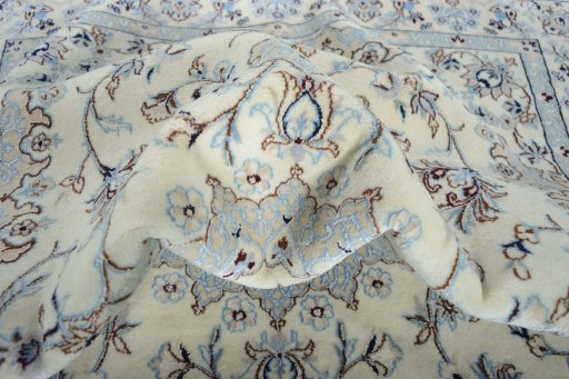 Backside of handmade New Nain rug showing knot structure and weave density