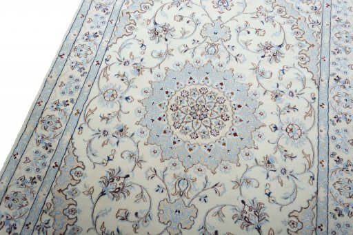 Backside of handmade New Nain rug showing knot structure and weave density
