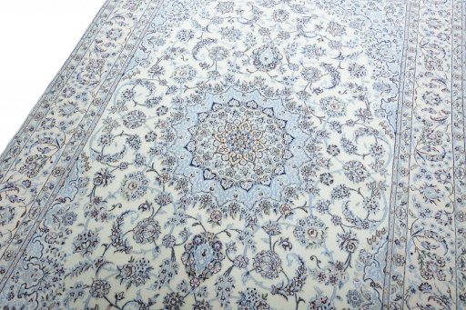Backside of handmade New Nain rug showing knot structure and weave density