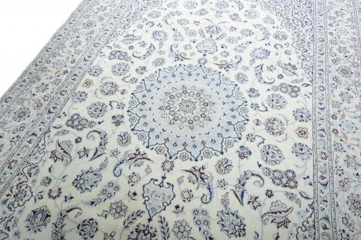 Backside of handmade New Nain rug showing knot structure and weave density